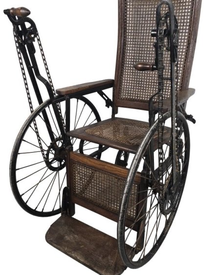 Period Wheelchair hand crank propelled.