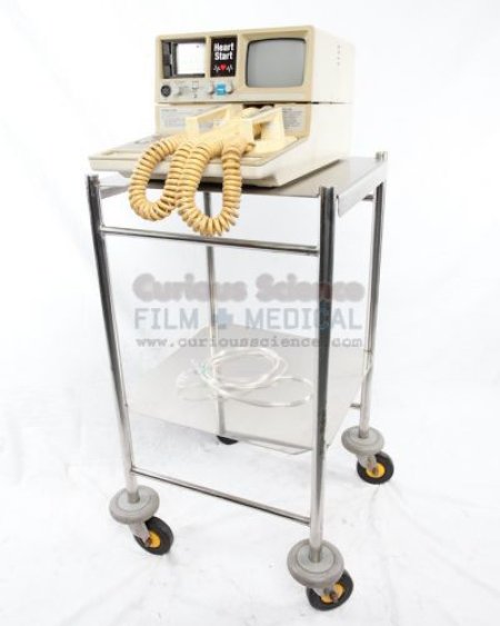 Defibrillator on stainless steel trolley Trolley priced seprerately 