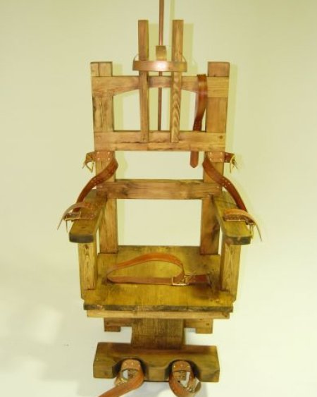 Wooden electric chair with leather restraining straps
