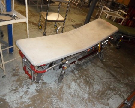 ambulance stretcher  green mattress and white