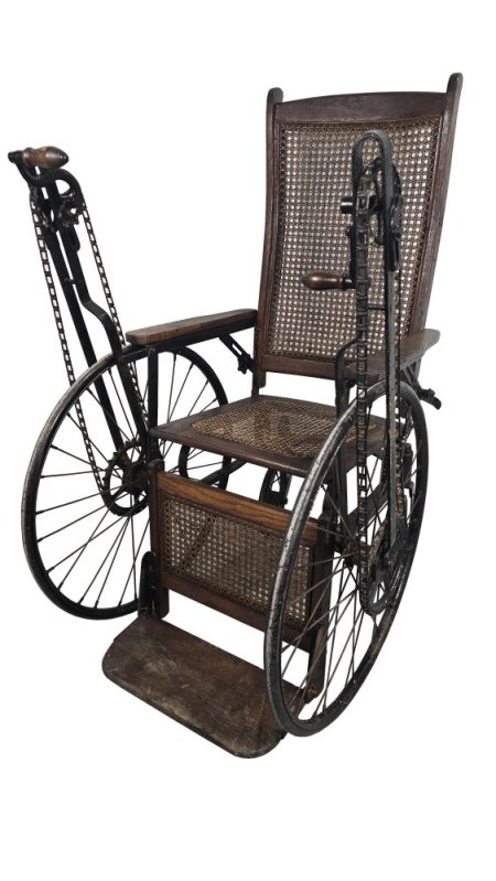 Period Wheelchair hand crank propelled.