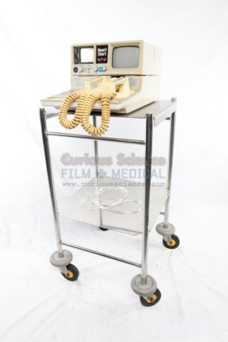 Defibrillator on stainless steel trolley Trolley priced seprerately 